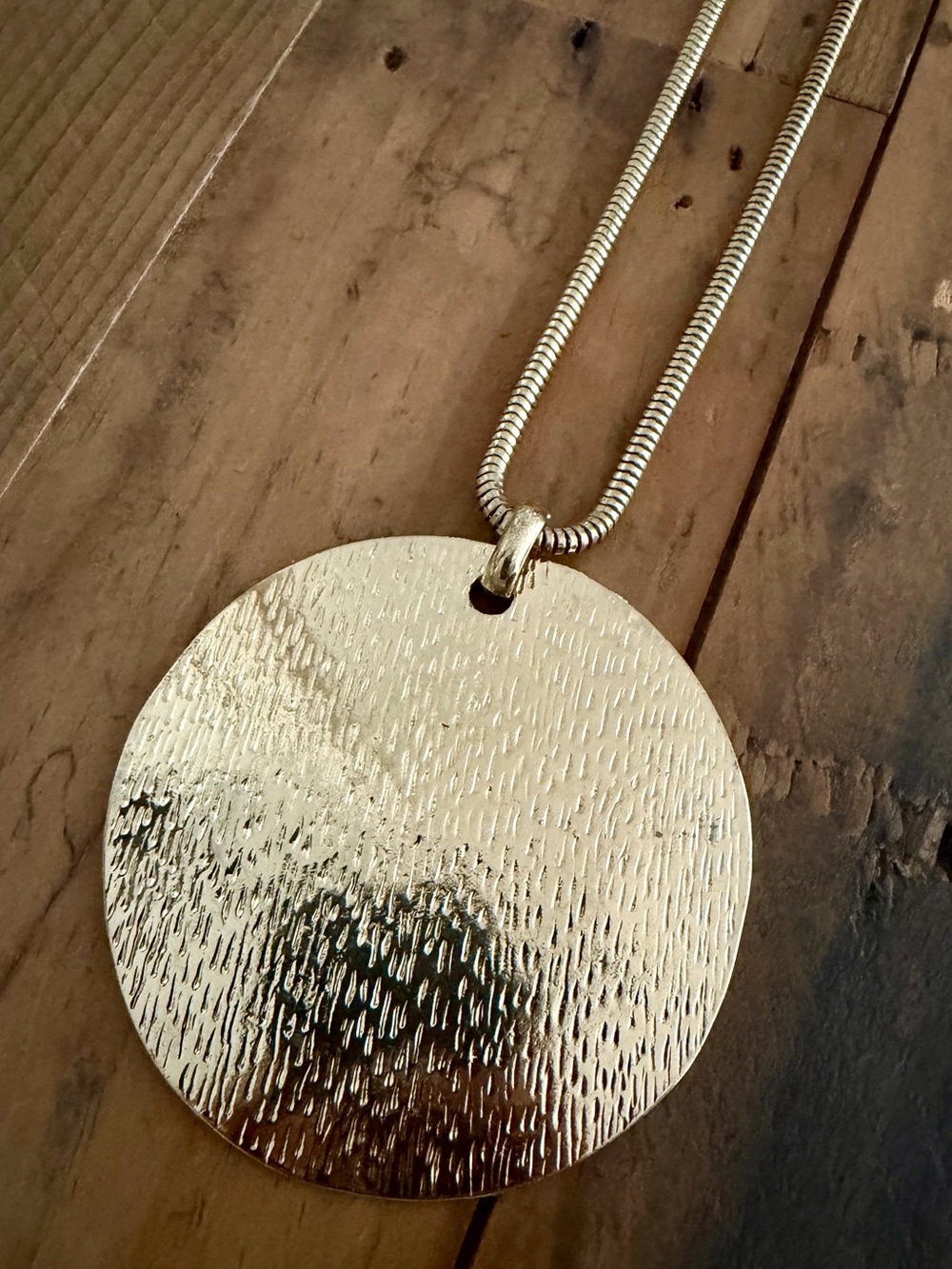 SNAKE CHAIN NECKLACE WITH LARGE GOLD-TONE TEXTURED DISC PENDANT